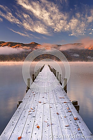 Jetty in Lake Chuzenji, Japan at sunrise in autumn Stock Photo